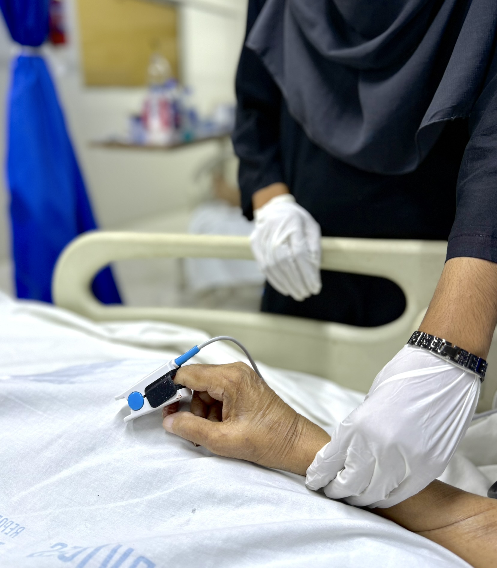 ICU staff attending to a patient at Dr. Aisha's Health Vision Hospital